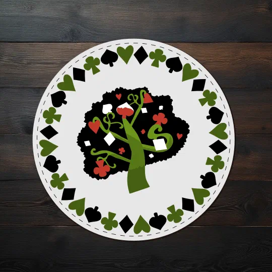 A round printed drink coaster on a dark wooden table