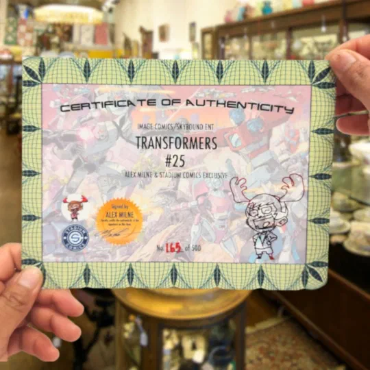 A printed, numbered certificate of authenticity held up in two hands